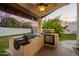 Outdoor kitchen featuring a built-in grill, counter space, and convenient access to the covered patio area at 3457 E Ellis St, Mesa, AZ 85213