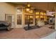 An entertainment patio with lots of windows, a ceiling fan, and a view of the backyard pool at 3457 E Ellis St, Mesa, AZ 85213