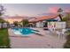 Relaxing pool with diving board, various patio seating and well manicured landscaping at 3457 E Ellis St, Mesa, AZ 85213