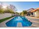 Enjoy this sparkling backyard pool with diving board and spacious patio, perfect for entertaining at 3457 E Ellis St, Mesa, AZ 85213