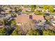 Rear exterior view showing patio, fenced yard, and swimming pool in a neighborhood with mature landscaping at 3457 E Ellis St, Mesa, AZ 85213