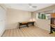 Bright bedroom with two desks, wood flooring, and a view of the patio at 349 W Gleneagles Dr, Phoenix, AZ 85023