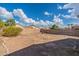 Large backyard with gravel and a block wall at 3555 S Moccasin Trl, Gilbert, AZ 85297