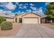 Single-story home with attached garage and landscaped front yard at 3555 S Moccasin Trl, Gilbert, AZ 85297