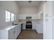 Modern kitchen featuring white cabinets and quartz countertops at 3555 S Moccasin Trl, Gilbert, AZ 85297