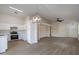 Open concept kitchen with modern appliances and light wood flooring at 3555 S Moccasin Trl, Gilbert, AZ 85297