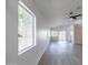 Spacious living room with large window and ceiling fan at 3555 S Moccasin Trl, Gilbert, AZ 85297