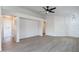 Open living room with neutral colors and wood-look flooring at 3555 S Moccasin Trl, Gilbert, AZ 85297