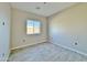 Simple bedroom with window and wood-look tile floors at 3720 N Del Monte Dr, Eloy, AZ 85131