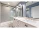Bathroom with double vanity and subway tile shower at 4639 E Mountain View Ct, Phoenix, AZ 85028