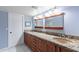 Bathroom boasts double sinks and granite countertops at 4639 E Mountain View Ct, Phoenix, AZ 85028