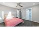 Charming bedroom with a pink bedspread and an ensuite bathroom at 4639 E Mountain View Ct, Phoenix, AZ 85028