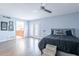 Primary bedroom with wood floors, ceiling fan, and ensuite bathroom at 4639 E Mountain View Ct, Phoenix, AZ 85028