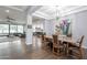Elegant dining room with hardwood floors and a large granite table at 4639 E Mountain View Ct, Phoenix, AZ 85028