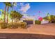 View of garage and landscaping at night at 4639 E Mountain View Ct, Phoenix, AZ 85028