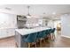 Modern kitchen with stainless steel appliances and large island with seating at 4639 E Mountain View Ct, Phoenix, AZ 85028