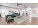 Spacious living area with hardwood floors and views into kitchen and dining areas at 4639 E Mountain View Ct, Phoenix, AZ 85028