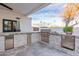 Modern outdoor kitchen with stainless steel appliances at 4639 E Mountain View Ct, Phoenix, AZ 85028