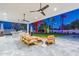 Covered patio with modern furniture, ceiling fans, and outdoor heaters at 4639 E Mountain View Ct, Phoenix, AZ 85028
