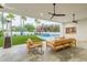 Relaxing patio with seating area, pool view, and modern ceiling fans at 4639 E Mountain View Ct, Phoenix, AZ 85028