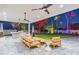 Covered patio with modern furniture, ceiling fans, and outdoor heaters at 4639 E Mountain View Ct, Phoenix, AZ 85028