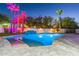 Modern pool and spa with dramatic lighting and a large patio at 4639 E Mountain View Ct, Phoenix, AZ 85028
