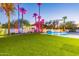 Expansive pool and spa with dramatic lighting and lush landscaping at 4639 E Mountain View Ct, Phoenix, AZ 85028