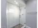 Clean and modern shower with white tile and glass enclosure at 4639 E Mountain View Ct, Phoenix, AZ 85028