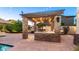 Enjoy alfresco dining in this stunning outdoor kitchen area at 4770 S Cotton Ct, Chandler, AZ 85248