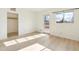 Bright bedroom with light wood floors and access to a patio at 5428 E El Sendero Dr, Cave Creek, AZ 85331