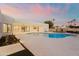 Expansive backyard with a pool, patio, and outdoor kitchen at 5825 E Cochise Rd, Paradise Valley, AZ 85253