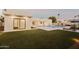 Landscaped backyard showcasing a luxurious pool and patio area at 5825 E Cochise Rd, Paradise Valley, AZ 85253