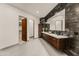 Bathroom boasts a floating vanity with marble countertop and walk-in closet at 5825 E Cochise Rd, Paradise Valley, AZ 85253