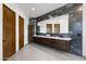 Contemporary bathroom with double vanity and sleek dark tile at 5825 E Cochise Rd, Paradise Valley, AZ 85253