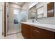 Elegant bathroom with a modern vanity and glass-enclosed shower at 5825 E Cochise Rd, Paradise Valley, AZ 85253