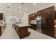 Spacious kitchen with island, stainless steel appliances, and wood cabinetry at 5825 E Cochise Rd, Paradise Valley, AZ 85253