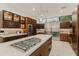 Modern kitchen with large island and stainless steel appliances at 5825 E Cochise Rd, Paradise Valley, AZ 85253