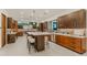 Gourmet kitchen featuring modern cabinetry, stainless steel appliances, and a large island at 5825 E Cochise Rd, Paradise Valley, AZ 85253