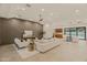 Open living space with a view of the pool and kitchen at 5825 E Cochise Rd, Paradise Valley, AZ 85253