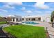 Inviting backyard oasis with a freeform pool and lounge chairs at 5825 E Cochise Rd, Paradise Valley, AZ 85253