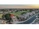 Aerial view of a home near a golf course with mountain views in the distance at 5951 W Irma Ln, Glendale, AZ 85308