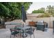 Outdoor kitchen, patio furniture, and umbrella create a relaxing backyard space at 5951 W Irma Ln, Glendale, AZ 85308