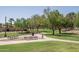 Paved pathway with benches, offering a relaxing stroll through the community at 5951 W Irma Ln, Glendale, AZ 85308