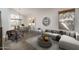 Bright living room featuring a large window, modern furnishings, and an open layout for seamless entertaining at 5951 W Irma Ln, Glendale, AZ 85308
