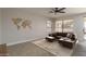 Cozy living room with a comfortable sofa, natural light, and an open floor plan at 5951 W Irma Ln, Glendale, AZ 85308