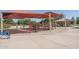 playground with swings, slides, and climbing structures at 5951 W Irma Ln, Glendale, AZ 85308