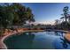 Inviting backyard pool with lush greenery and relaxing lounge chairs, perfect for outdoor enjoyment at 5951 W Irma Ln, Glendale, AZ 85308
