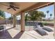 Relaxing covered patio overlooking the fenced pool with comfortable lounge chairs at 5951 W Irma Ln, Glendale, AZ 85308