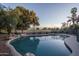 Private pool with desert landscaping and golf course in the background at 5951 W Irma Ln, Glendale, AZ 85308