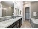 Elegant bathroom with double sinks, soaking tub, and walk-in shower at 6565 E Thomas Rd # 1005, Scottsdale, AZ 85251